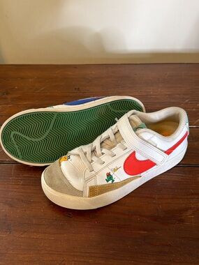 Nike Kids White Sneakers with Red Swoosh and Green Sole